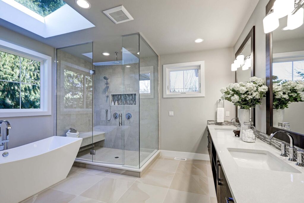 Bathroom with beige floor tiles and grey shower tiles in Green Bay, WI
