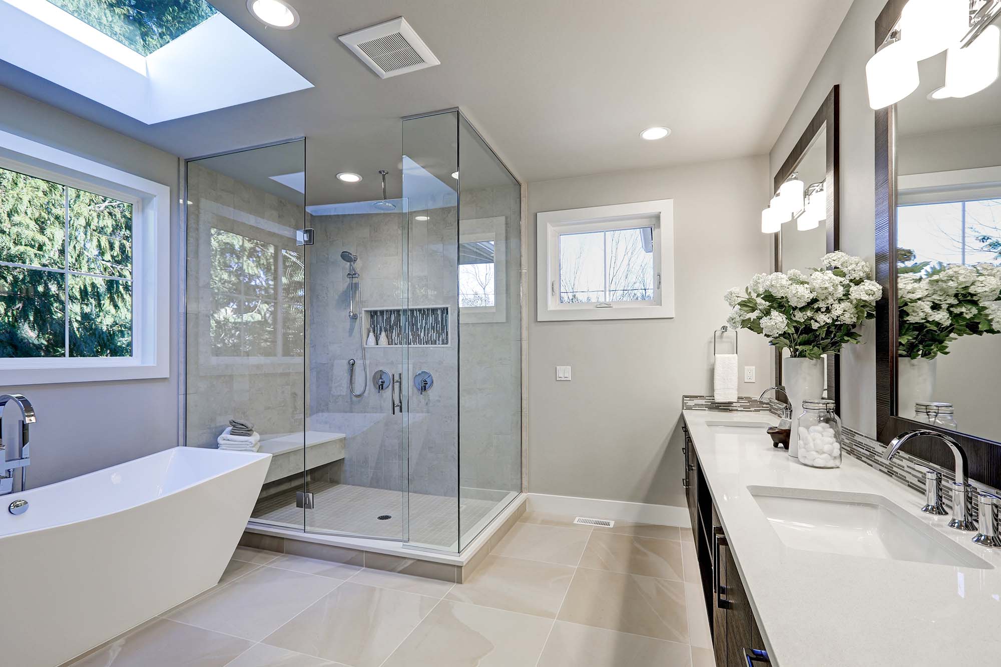 Bathroom with beige floor tiles and grey shower tiles in Green Bay, WI